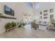 Bright living room featuring high ceilings, light wood flooring, and sliding glass doors to the backyard at 16425 S 34Th St, Phoenix, AZ 85048