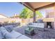 The covered patio has a built in BBQ and views of the pool and backyard at 16425 S 34Th St, Phoenix, AZ 85048