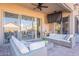 Covered patio has comfortable seating and sliding glass doors to blend indoor-outdoor living at 16425 S 34Th St, Phoenix, AZ 85048