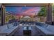 Covered patio area includes comfortable seating and views of the pool and backyard at 16425 S 34Th St, Phoenix, AZ 85048