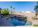 Sparkling pool with a built-in waterfall feature provides a refreshing escape on sunny days at 16425 S 34Th St, Phoenix, AZ 85048