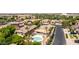 Aerial neighborhood view showcasing a backyard pool oasis, desert landscaping, and inviting curb appeal at 1643 N 144Th Dr, Goodyear, AZ 85395
