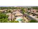 Aerial view of a neighborhood home with a pool, landscaping, and inviting outdoor living space at 1643 N 144Th Dr, Goodyear, AZ 85395