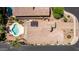 Aerial view of a home with a pool and solar panels, showcasing its modern amenities and outdoor space at 1643 N 144Th Dr, Goodyear, AZ 85395