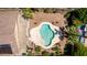 Aerial view of a backyard featuring a refreshing pool, patio area, and desert landscaping at 1643 N 144Th Dr, Goodyear, AZ 85395