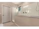 Modern bathroom featuring a walk-in shower with clear glass door and neutral tones at 1643 N 144Th Dr, Goodyear, AZ 85395