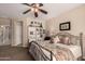 Cozy bedroom with a ceiling fan, and neutral décor at 1643 N 144Th Dr, Goodyear, AZ 85395