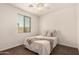 Bright bedroom with neutral decor and a comfortable bed at 1643 N 144Th Dr, Goodyear, AZ 85395