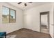 Bedroom showcasing a ceiling fan, window, and closet at 1643 N 144Th Dr, Goodyear, AZ 85395