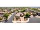 Beautiful single-Gathering home featuring desert landscaping, paved driveway, and solar panels at 1643 N 144Th Dr, Goodyear, AZ 85395