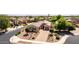 Beautiful home with desert landscaping, a paver driveway, and a well-maintained front yard at 1643 N 144Th Dr, Goodyear, AZ 85395