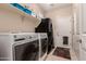 Laundry room features modern appliances and ample storage space at 1643 N 144Th Dr, Goodyear, AZ 85395