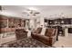 Bright open-concept living space with breakfast bar, dining area and travertine floors at 1643 N 144Th Dr, Goodyear, AZ 85395