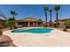 Inviting backyard pool with a spacious patio and covered seating area, ideal for outdoor entertaining at 1643 N 144Th Dr, Goodyear, AZ 85395