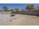 Backyard featuring a paver patio, turf area, mature trees, and a privacy wall at 16836 W Vereda Solana Dr, Surprise, AZ 85387
