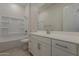 Bright bathroom with a shower-tub combo and white vanity at 16836 W Vereda Solana Dr, Surprise, AZ 85387