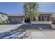 Charming single-story home featuring desert landscaping and a two-car garage at 16836 W Vereda Solana Dr, Surprise, AZ 85387
