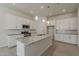 Well-lit kitchen with granite countertops, stainless steel appliances, and white cabinetry at 16836 W Vereda Solana Dr, Surprise, AZ 85387