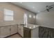 Charming kitchen island features granite countertops and seating space at 16836 W Vereda Solana Dr, Surprise, AZ 85387