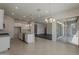 Stylish kitchen featuring an island with granite countertops and backyard views at 16836 W Vereda Solana Dr, Surprise, AZ 85387