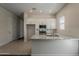 Inviting kitchen space with granite countertops, stainless steel appliances and white cabinetry at 16836 W Vereda Solana Dr, Surprise, AZ 85387