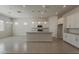 Modern kitchen featuring an island, stainless steel appliances, and tile flooring at 16836 W Vereda Solana Dr, Surprise, AZ 85387