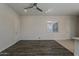 Spacious open-concept space featuring hard wood flooring, recessed lighting and ceiling fan at 16836 W Vereda Solana Dr, Surprise, AZ 85387