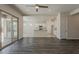 Bright, open-concept living area flows into a modern kitchen with a large sliding door at 16836 W Vereda Solana Dr, Surprise, AZ 85387