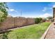 Well-maintained backyard with lush green lawn, block wall fence, and tidy landscaping providing a private outdoor space at 1721 W Kingbird Dr, Chandler, AZ 85286