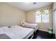 Shared bedroom featuring two beds and a window with valance to let the natural light in at 1721 W Kingbird Dr, Chandler, AZ 85286