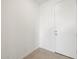 Entryway with white walls and a sleek, modern door for a clean aesthetic at 17334 W Eva St, Waddell, AZ 85355