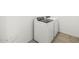 A clean laundry room featuring a modern washer and dryer at 17334 W Eva St, Waddell, AZ 85355