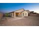 View of home's backyard featuring covered patio and low-maintenance gravel landscaping at 18344 W Getty Dr, Goodyear, AZ 85338