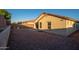 A backyard featuring gravel, a patio, and block wall fencing for added privacy at 18344 W Getty Dr, Goodyear, AZ 85338