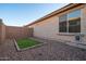 View of fenced side yard featuring gravel and small turf area at 18344 W Getty Dr, Goodyear, AZ 85338