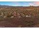 Scenic aerial view capturing a large residential area near mountains and desert landscape at 1917 E Karen Dr, Phoenix, AZ 85022