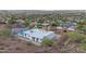 Aerial view showcasing the home, its pool, and lush landscaping within a desert community at 1917 E Karen Dr, Phoenix, AZ 85022
