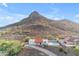 Inviting aerial shot of home features lush desert landscaping, sparkling pool and view of mountain at 1917 E Karen Dr, Phoenix, AZ 85022