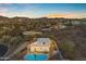 Home with private pool and lush desert landscaping, showcasing mountain views in the distance at 1917 E Karen Dr, Phoenix, AZ 85022