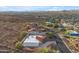 Scenic aerial view of home highlighting neighborhood, desert landscaping, mountain views, pool, and lush greenery at 1917 E Karen Dr, Phoenix, AZ 85022