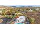 The aerial shot highlights the property, its pool, and beautiful mountain views at 1917 E Karen Dr, Phoenix, AZ 85022