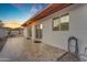 Backyard patio with tiled floor, large windows, and a view of desert landscaping at 1917 E Karen Dr, Phoenix, AZ 85022