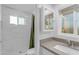 Bathroom featuring marble-tiled shower with green shower curtain and mountain view at 1917 E Karen Dr, Phoenix, AZ 85022