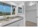 Bright bathroom with a single sink vanity and view of the mountains and city at 1917 E Karen Dr, Phoenix, AZ 85022