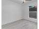 Bright bedroom features stylish wood-look tile flooring and a ceiling fan for added comfort at 1917 E Karen Dr, Phoenix, AZ 85022