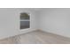 This bedroom features bright walls, wood-look tile flooring and a window at 1917 E Karen Dr, Phoenix, AZ 85022