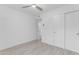 The bedroom offers bright white walls, closet and stylish wood-look tile flooring at 1917 E Karen Dr, Phoenix, AZ 85022