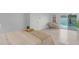 Bright bedroom with light wood floors and a view of the outdoor pool through sliding glass doors at 1917 E Karen Dr, Phoenix, AZ 85022
