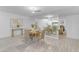 Bright dining room with mirrored wall that reflects into the living room with fireplace and couches at 1917 E Karen Dr, Phoenix, AZ 85022