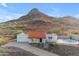 Charming house with a red tile roof, desert landscaping, attached garage, and a pristine pool at 1917 E Karen Dr, Phoenix, AZ 85022